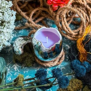 bougie parfumée dans son oeuf d'occamy the wizarding trunk