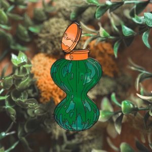 pin's de la prof en rose qui jongle the wizarding trunk (copie)
